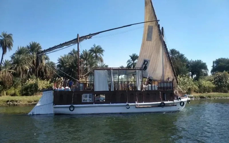 Dendera by lotus boat — traditional Egyptian wooden vessel sailing from Luxor to Dendera